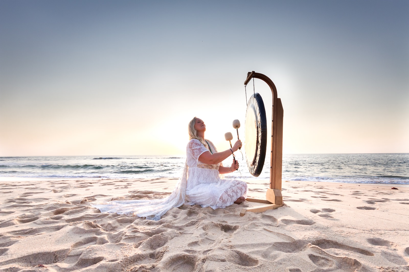 Sharmila Devasya with gong at the beach